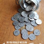 jar of quarters on table - emergency fund - with text "Create an emergency fund"