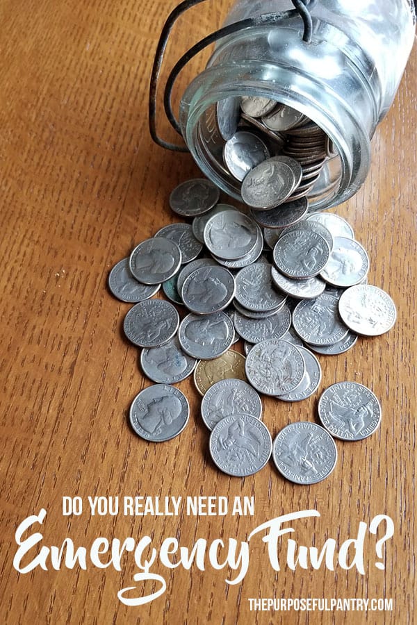 jar of quarters on table - emergency fund - with text "Create an emergency fund"