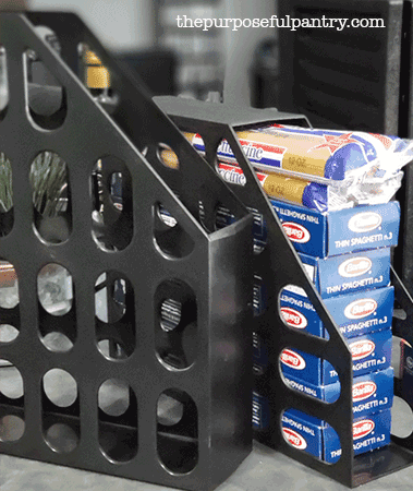 2 black, plastic magazine holders to hold boxed spaghetti for organized pantry