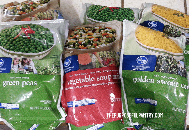 Bags of frozen vegetables being prepared for dehydrating.