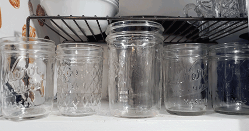 Canning jars for drinking in cupboard shelf - 15+ ways to repurpose canning jars