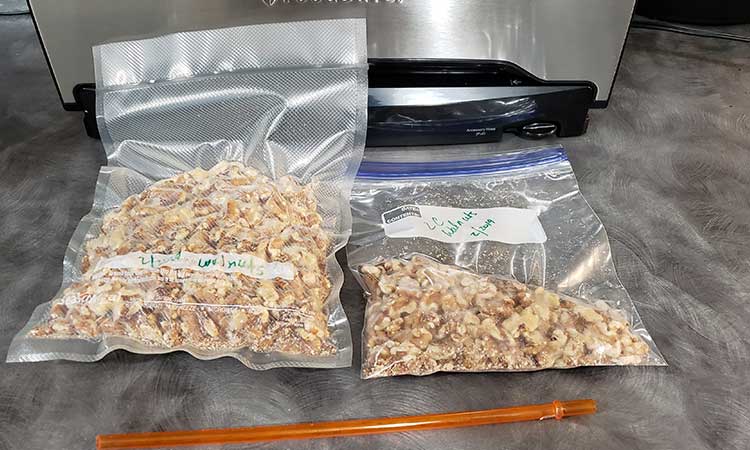 2 bags of walnuts and a FoodSaver vacuum sealer for storing nuts