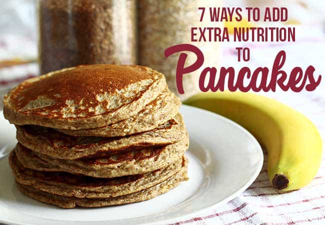 a stack of whole wheat pancakes on a white plate with a banana - for extra nutrition for pancakes
