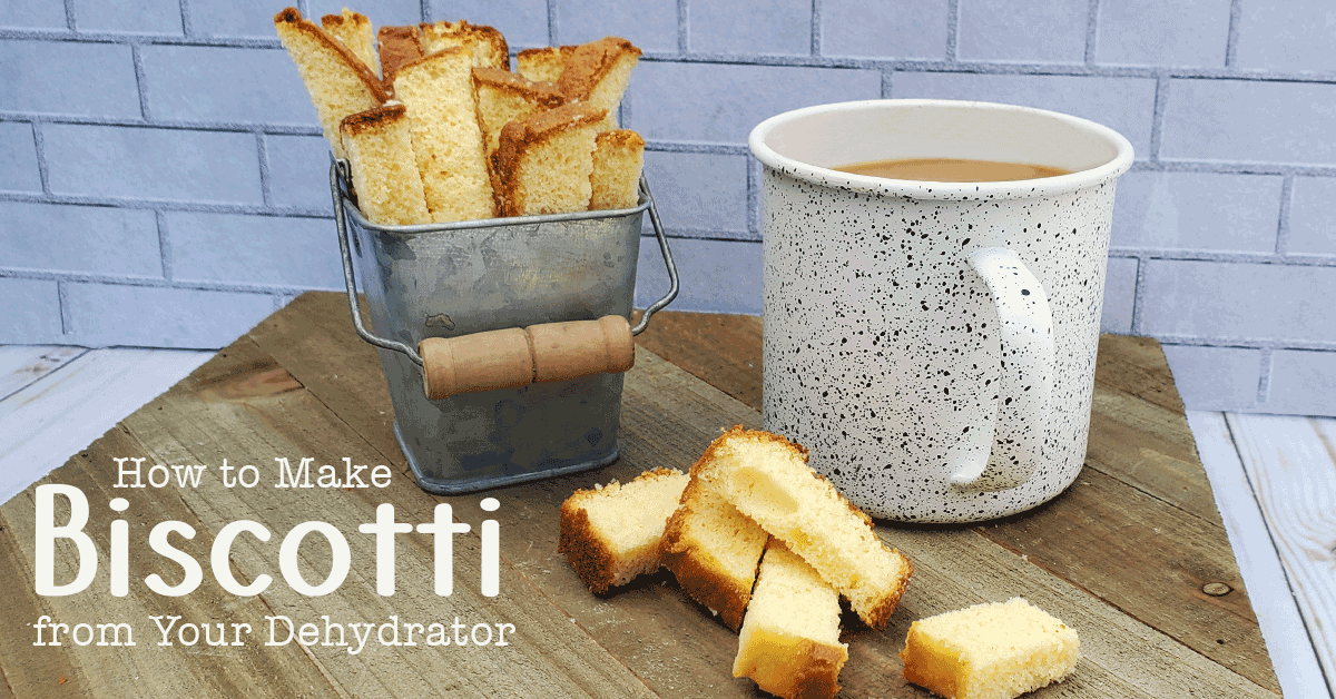 DIY Biscotti in a metal container with white coffee cup on wooden background.