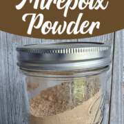 Mason jar full of mirepoix power on wooden background with text overay "Make your own dehydrated mirepoix power with a twist"