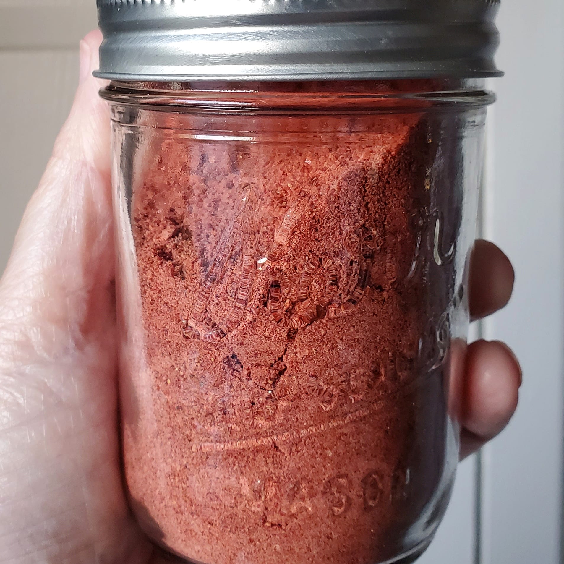 Jar of dehydrated strawberry powder