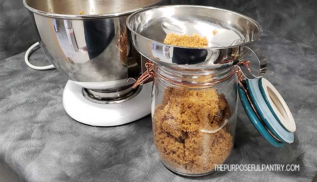 Kitchen Aid mixer with a glass jar of homemade brown sugar