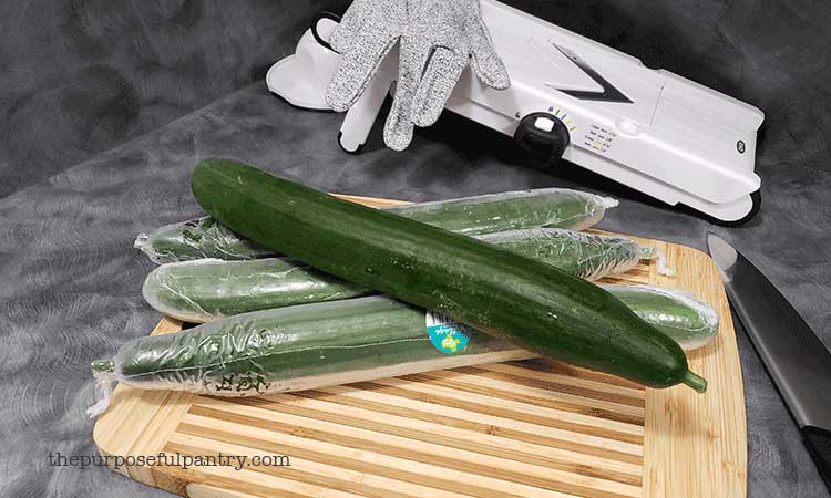english cucumbers on cutting board ready to be sliced