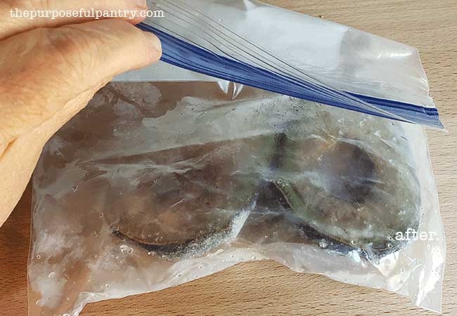 A freezer bag of oxidized and dark avocado halves demonstrating how NOT to freeze avocados