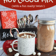Mason jar of hot cocoa bulk mix alongside a coffee mug of hot cocoa with dehydrated marshmallows