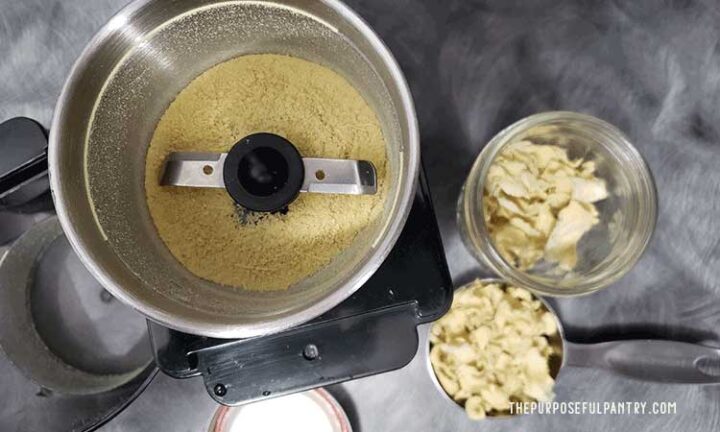 ginger powder in a coffee grinder plus ginger bits in a jar and spoon