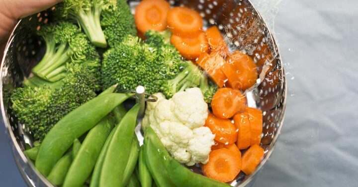 cut vegetables in steamer basket