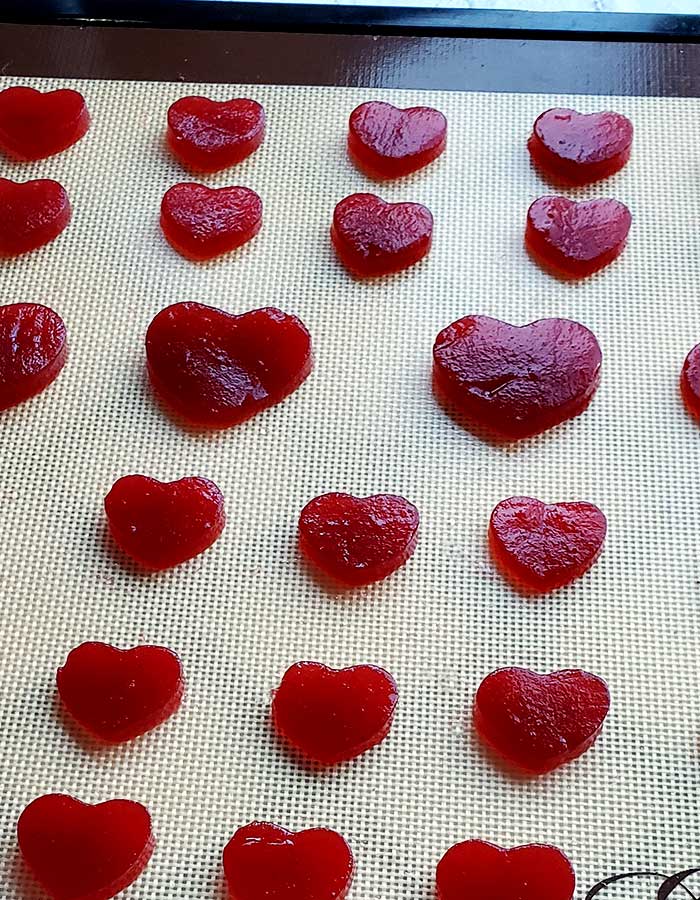 Heart-shaped cutouts of jellied cranberry sauce on an Excalibur dehydrator tray