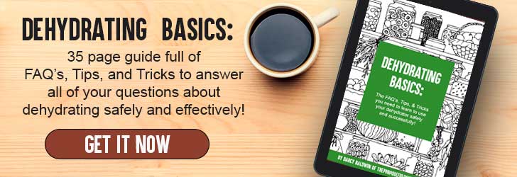 Dehydrating Basics ebook on a tablet with a cup of coffee on a wooden background