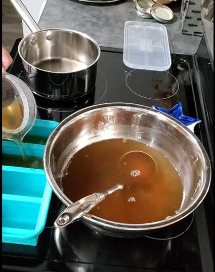 Metal container of freshly made broth with a Souper Cube system to freeze broth