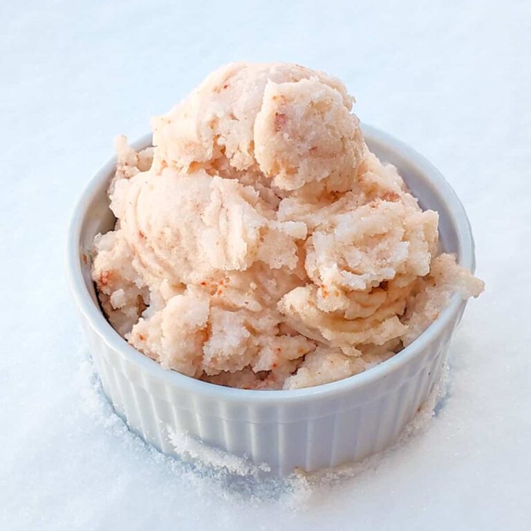 A bowl of Strawberry Snow Cream on a snowy background