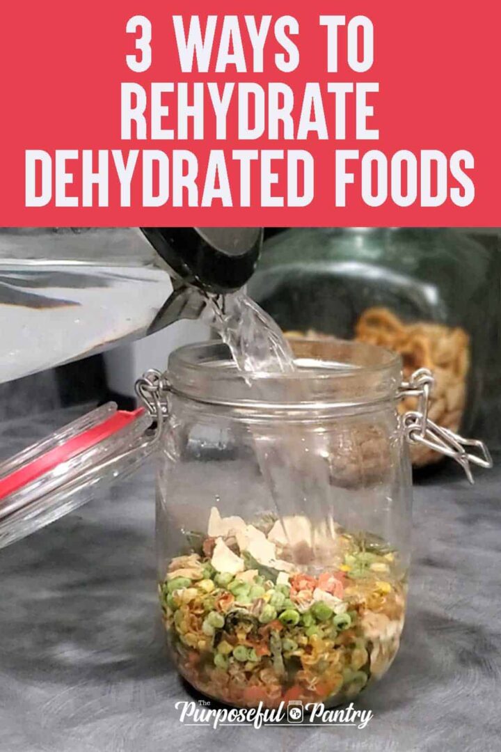 Glass clamp jar with water pouring into it to rehydrate the dehydrated vegetables indside