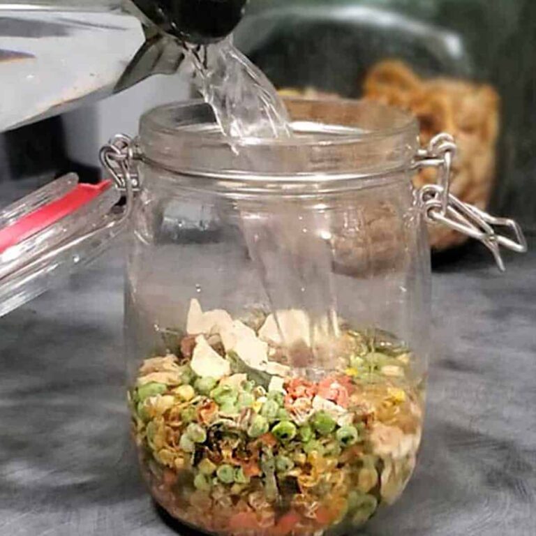 Hot water poured over dehydrated vegetables to rehydrate them for a meal