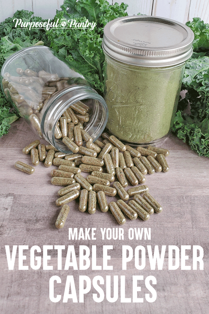 Bottle of vegetable powder capsules spilling in front of jar of dehydrated green powder in front of fresh greens.