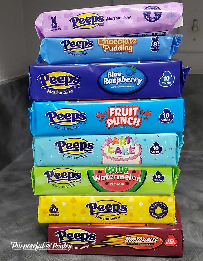 Packages of Marshmallow Peeps arranged in rainbow order being prepared to dehydrate them