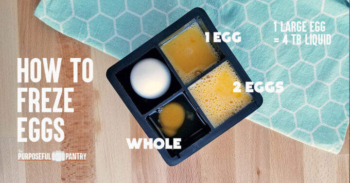 Eggs broken into ice cube compartments for freezing - in different quantities. On a blue cloth and wooden surface