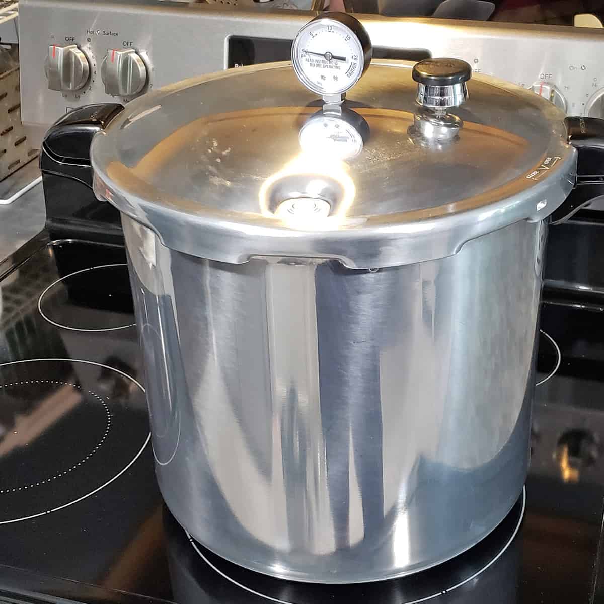 Presto 23 QT canner on top of a glasstop stove