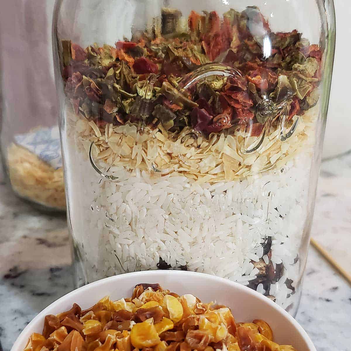 Taco soup ingredients layered in a canning jar for the a 'meal in the jar' pantry staple