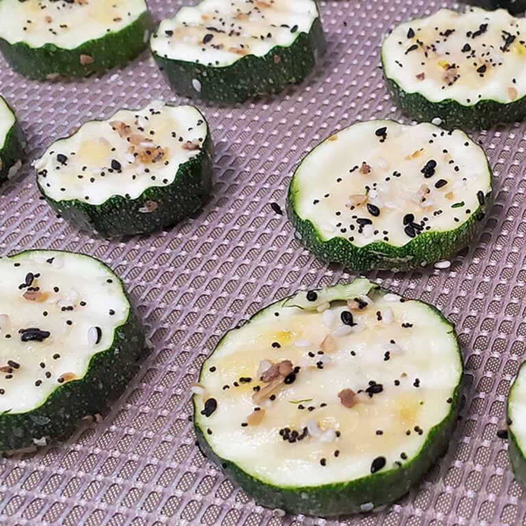 zucchini chips with bagel seasoning on an Excalibur dehydrator tray
