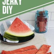 Watermelon slice on a blue plate with napkin and slices of dehydrated watermelon jerky