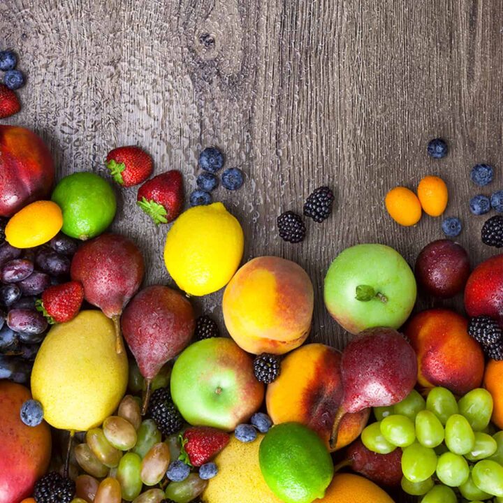 A variety of fruits on a wooden surface