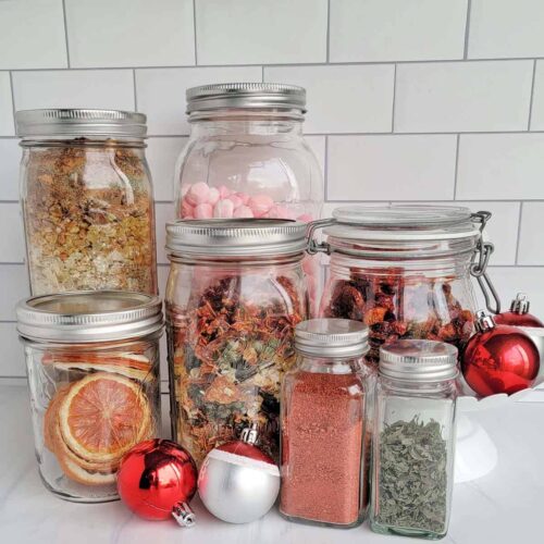 Dehydrated food gifts in jars on the kitchen counter with Christmas ornaments
