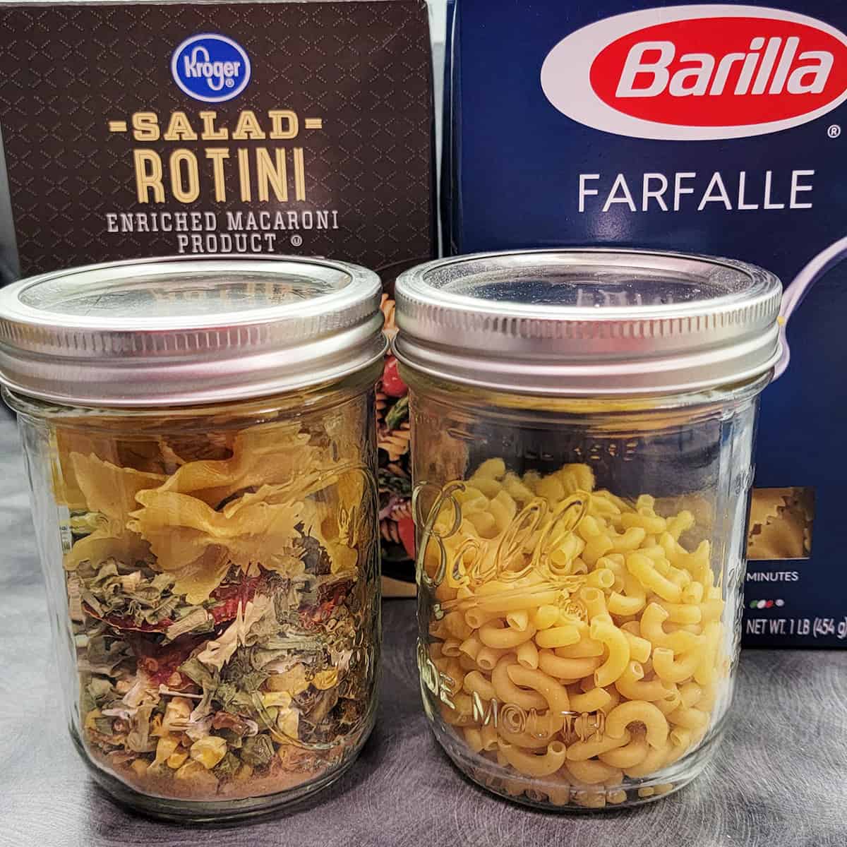 A Dehydrated meal in a jar next to dehydrated pasta