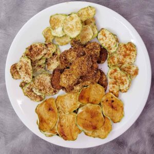 Plate of seasoned dehydrated zucchini chips