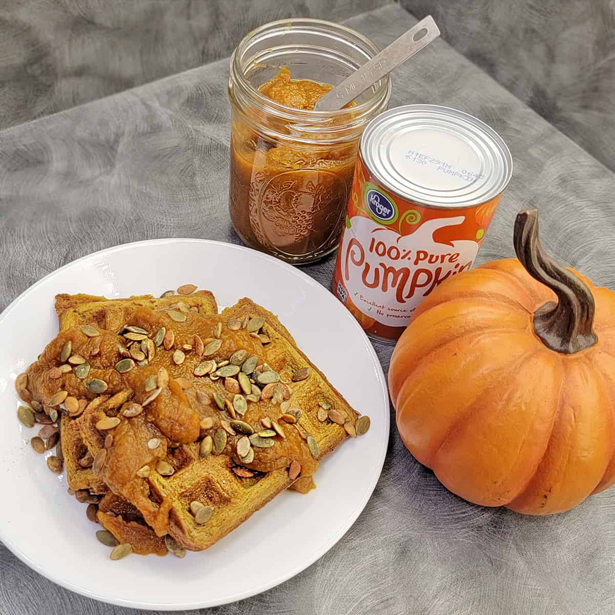 Pumpkin waffle with pumpkin butter and pepitas along with ingredients