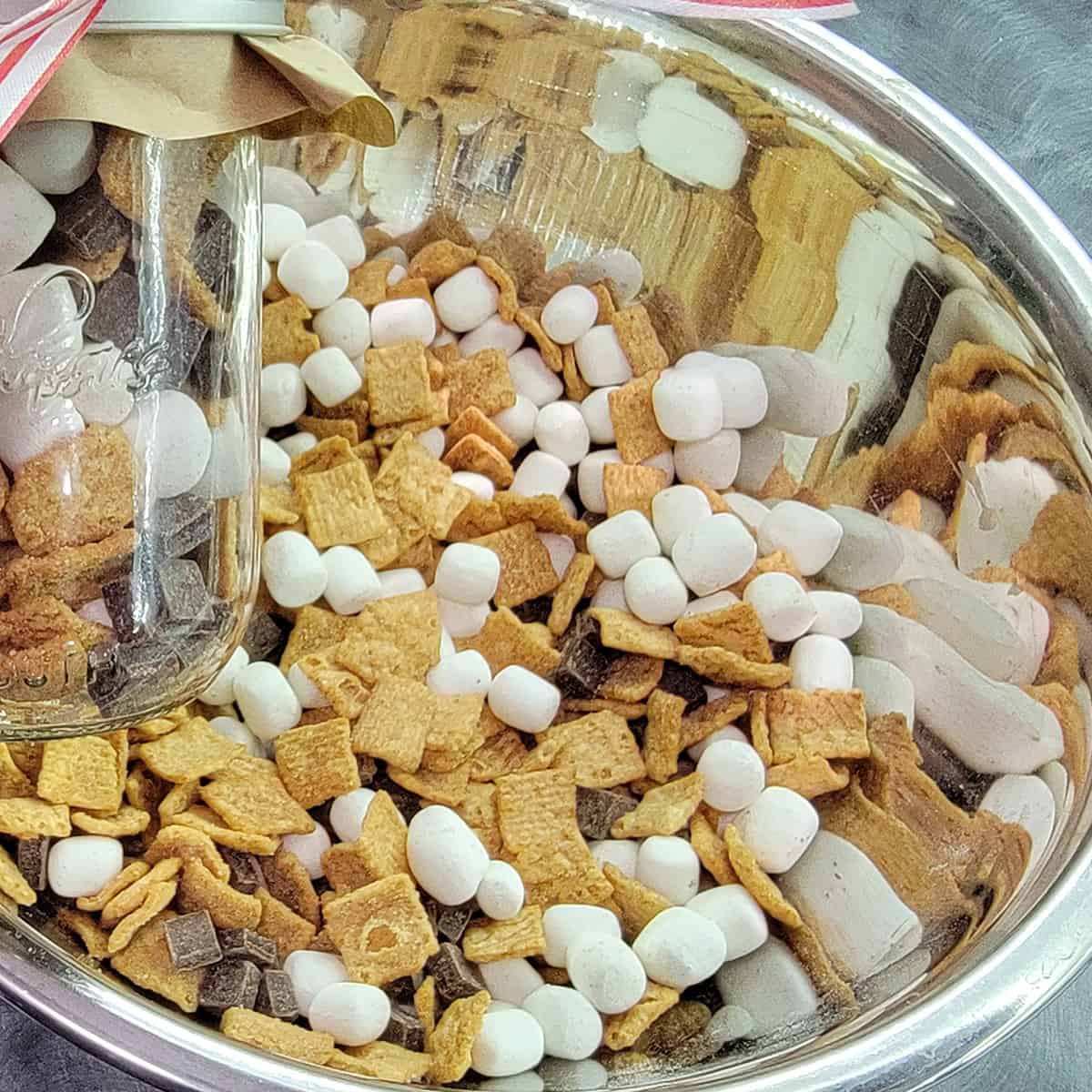 Crunchy s'more mix in a stainless steel bowl.