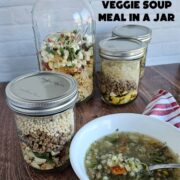 Meals in a jar of instant beef and vegetable soup; one with rice, one with pasta, one with couscous.