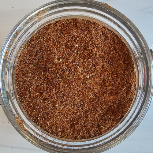 Glass jar of bulk diy taco seasoning mix from above.