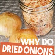 Dried onions in a jar with the text why do dried onions turn pink?.