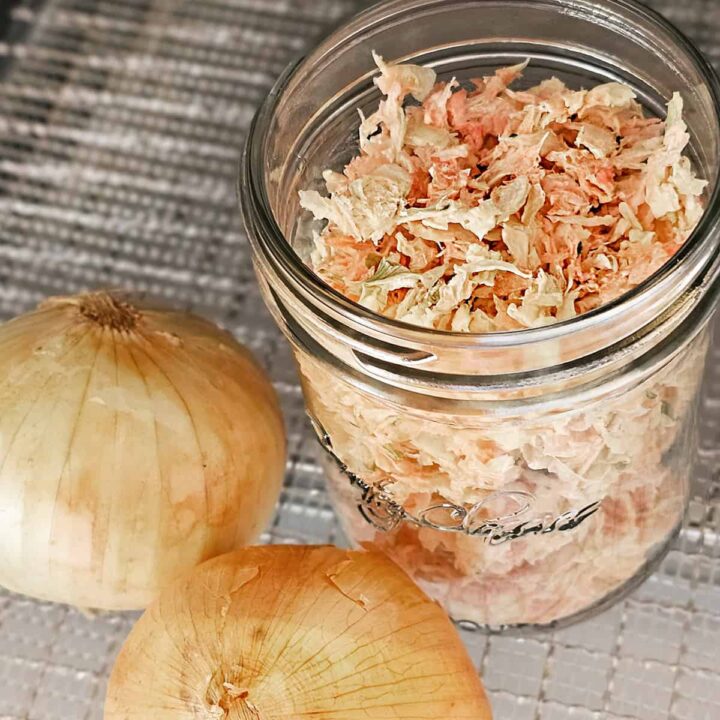 Shredded onions in a jar on a table.