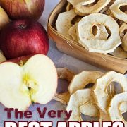 A stack of dried apple rings in a basket next to fresh apples.